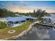 Waterfront home features metal roof, dock, and boat lift for enjoying waterfront living at 100 18Th Nw St, Ruskin, FL 33570