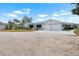Charming one story home featuring a spacious lot and two car garage at 100 18Th Nw St, Ruskin, FL 33570
