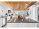 Open kitchen featuring stainless steel appliances, a large island, and views into the dining area at 100 18Th Nw St, Ruskin, FL 33570