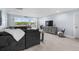 Spacious living room featuring stylish decor, comfortable seating, tile flooring, and beautiful waterfront views at 100 18Th Nw St, Ruskin, FL 33570