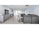 Open-concept living room featuring tile flooring, modern decor, comfortable seating, and lots of natural light at 100 18Th Nw St, Ruskin, FL 33570
