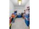 Spacious storage room filled with labeled bins and an overhead light at 100 18Th Nw St, Ruskin, FL 33570