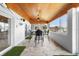 Sunroom with a wood-planked ceiling, floor to ceiling windows, and a waterfront view at 100 18Th Nw St, Ruskin, FL 33570