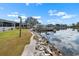 Waterfront with home, boat dock, and rock seawall with lovely water views at 100 18Th Nw St, Ruskin, FL 33570