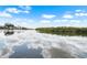 Waterfront view of the river lined with trees and houses at 100 18Th Nw St, Ruskin, FL 33570