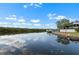Beautiful view of the waterfront with homes and boat docks on a clear day at 100 18Th Nw St, Ruskin, FL 33570