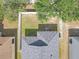 An aerial view shows the house's roof, AC unit, and fenced backyard with ample space and mature trees at 1022 Chandler Snowden Ct, Ruskin, FL 33570