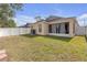 Well-maintained backyard with a white fence, perfect for outdoor activities and relaxation at 1022 Chandler Snowden Ct, Ruskin, FL 33570