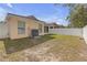 Large backyard featuring a white fence and plenty of space for outdoor enjoyment at 1022 Chandler Snowden Ct, Ruskin, FL 33570