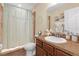 Traditional bathroom featuring a vanity, ceramic tile floors, and framed mirror at 1022 Chandler Snowden Ct, Ruskin, FL 33570