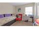 Cozy bedroom featuring soft lighting, a daybed, and serene decor at 1022 Chandler Snowden Ct, Ruskin, FL 33570