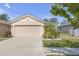 Charming single-story home featuring a two-car garage and well-maintained landscaping at 1022 Chandler Snowden Ct, Ruskin, FL 33570