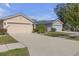 Charming home with a two-car garage and well-manicured landscaping at 1022 Chandler Snowden Ct, Ruskin, FL 33570