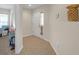 Bright foyer featuring tiled flooring and neutral walls, leading to other rooms at 1022 Chandler Snowden Ct, Ruskin, FL 33570