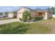 Well-manicured front yard showcases a charming home with a vibrant garden at 1022 Chandler Snowden Ct, Ruskin, FL 33570