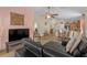 Open-concept living room flows into dining area and kitchen, with tile floors and natural light at 1022 Chandler Snowden Ct, Ruskin, FL 33570