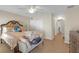Comfortable main bedroom with a decorative headboard and large closet at 1022 Chandler Snowden Ct, Ruskin, FL 33570