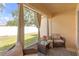 Inviting screened patio with comfortable seating and peaceful backyard view at 1022 Chandler Snowden Ct, Ruskin, FL 33570