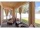 Relaxing screened patio with cozy seating and view of the backyard at 1022 Chandler Snowden Ct, Ruskin, FL 33570