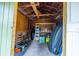 Inside a shed: exposed wood framing, pegboard, shelving, and room for storage at 1211 E Comanche Ave, Tampa, FL 33604