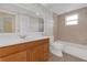 Bathroom featuring a bathtub with a shower and a modern vanity at 12817 Lake Tree Ln, Hudson, FL 34669