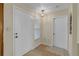 Welcoming foyer with a neutral color scheme and tiled floor at 12817 Lake Tree Ln, Hudson, FL 34669