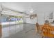 Spacious garage featuring an open garage door and a kitchen nook at 12817 Lake Tree Ln, Hudson, FL 34669