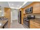 Updated kitchen features granite countertops, stainless steel appliances and ample cabinet space at 12817 Lake Tree Ln, Hudson, FL 34669
