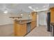 Open kitchen featuring granite countertops, stainless steel appliances, and open view to living room at 12817 Lake Tree Ln, Hudson, FL 34669