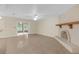 Bright living room with sliding glass doors and fireplace at 12817 Lake Tree Ln, Hudson, FL 34669