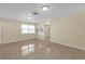 Spacious living area with tiled flooring and abundant natural light at 12817 Lake Tree Ln, Hudson, FL 34669