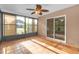 Bright sunroom featuring tile floors and sliding glass doors to the main house at 12817 Lake Tree Ln, Hudson, FL 34669