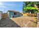 Large backyard with privacy fence, and a concrete patio, providing a great space for entertaining at 1408 Birchstone Ave, Brandon, FL 33511