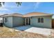 Rear of home showing sliding glass door leading to concrete patio and fenced in yard for extra privacy at 1408 Birchstone Ave, Brandon, FL 33511