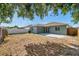 Spacious backyard with a concrete patio, partial fence, and ample room for outdoor activities at 1408 Birchstone Ave, Brandon, FL 33511