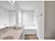 Bright bathroom featuring double sinks and a shower-tub combination at 1408 Birchstone Ave, Brandon, FL 33511