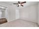 Bedroom features neutral carpet, a ceiling fan and a closet at 1408 Birchstone Ave, Brandon, FL 33511