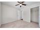 Well-lit bedroom features neutral carpet, a ceiling fan and a walk-in closet at 1408 Birchstone Ave, Brandon, FL 33511