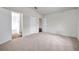 Bedroom with carpet flooring, a view to the bathroom and closet at 1408 Birchstone Ave, Brandon, FL 33511