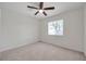 Bedroom features neutral carpet, a ceiling fan and a bright window at 1408 Birchstone Ave, Brandon, FL 33511