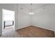 Bright dining room with wood floors and modern chandelier lighting at 1408 Birchstone Ave, Brandon, FL 33511