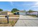 Inviting single-story home boasts a well-kept lawn, large driveway, and convenient two-car garage at 1408 Birchstone Ave, Brandon, FL 33511