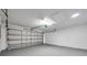 Spacious two-car garage with overhead lighting and a utility door at 1408 Birchstone Ave, Brandon, FL 33511
