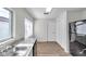 Kitchen with stainless steel appliances, white cabinets, and a bright window at 1408 Birchstone Ave, Brandon, FL 33511