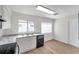 Well-lit kitchen showcasing stainless sink, dishwasher, and marble countertops at 1408 Birchstone Ave, Brandon, FL 33511