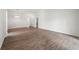 Open-concept living space with hardwood floors and recessed lighting at 1408 Birchstone Ave, Brandon, FL 33511