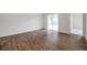Large room with beautiful hardwood floors and sliding glass doors at 1408 Birchstone Ave, Brandon, FL 33511