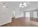 Spacious living room features new hardwood floors, neutral walls, and sliding doors to backyard at 1408 Birchstone Ave, Brandon, FL 33511
