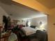 Bedroom featuring a queen bed, a dark headboard, and an ensuite desk at 1445 72Nd Ne Ave, St Petersburg, FL 33702