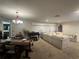 Spacious living and dining area with a comfortable sofa and carpeted flooring at 1445 72Nd Ne Ave, St Petersburg, FL 33702